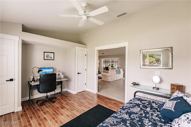 bedroom with ceiling fan and vaulted ceiling