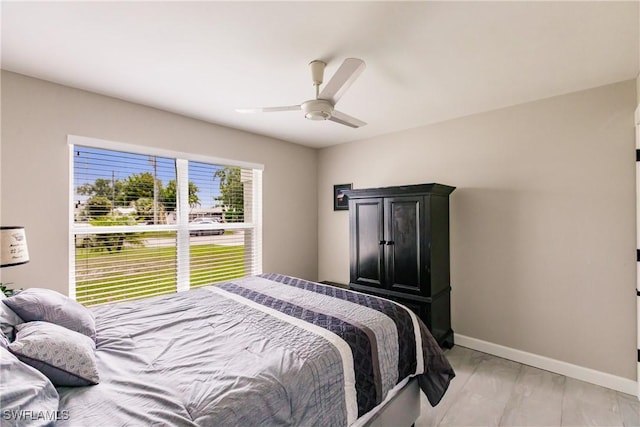 bedroom featuring light hardwood / wood-style flooring and ceiling fan