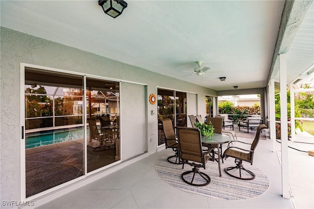 view of patio featuring ceiling fan