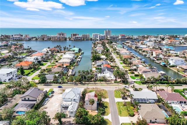 birds eye view of property featuring a residential view and a water view