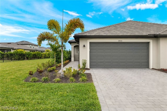 view of front facade with a front lawn and a garage