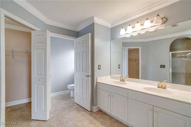 bathroom featuring tile patterned flooring, toilet, a shower with shower door, ornamental molding, and vanity