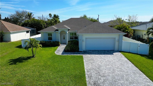 ranch-style house with a garage, fence, decorative driveway, a front yard, and stucco siding