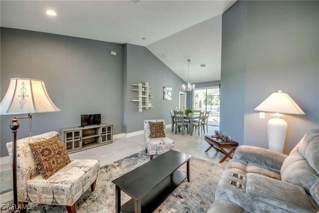 living room with baseboards, high vaulted ceiling, visible vents, and a notable chandelier