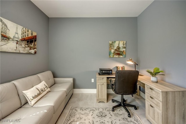 office space featuring light tile patterned floors and baseboards