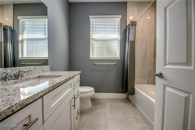 full bathroom featuring plenty of natural light, baseboards, tile patterned flooring, and vanity