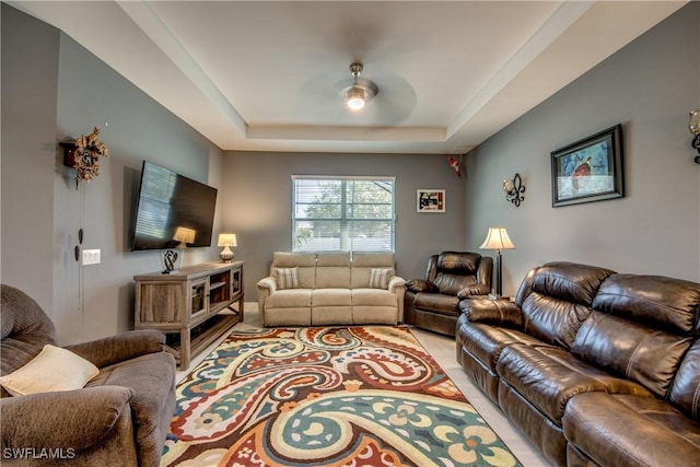 living room with a tray ceiling