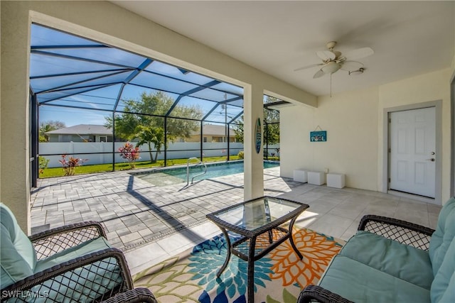 view of patio featuring a fenced in pool, a lanai, fence, and ceiling fan