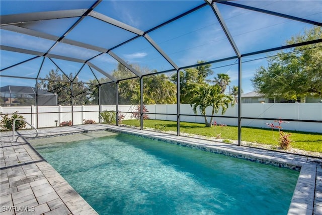 view of swimming pool featuring a patio area, a fenced backyard, glass enclosure, and a fenced in pool