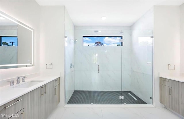 bathroom with an enclosed shower and vanity