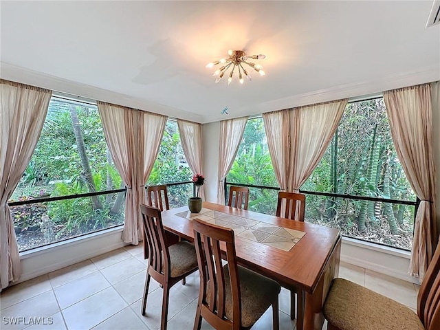 dining room with light tile patterned floors, plenty of natural light, and visible vents