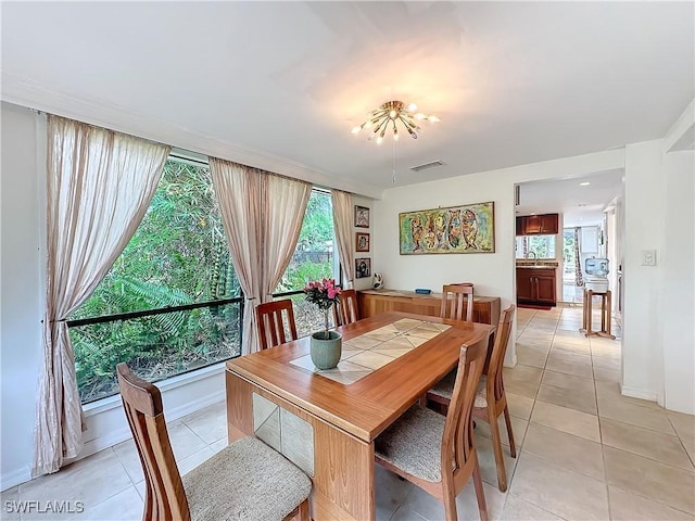 dining space featuring visible vents and light tile patterned floors