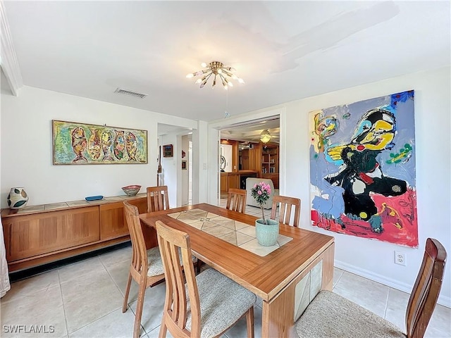 dining area with visible vents, baseboards, and light tile patterned floors