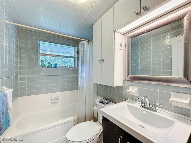 full bath featuring toilet, vanity, tile walls, shower / tub combo with curtain, and tasteful backsplash