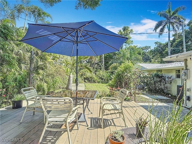 wooden deck with outdoor dining space