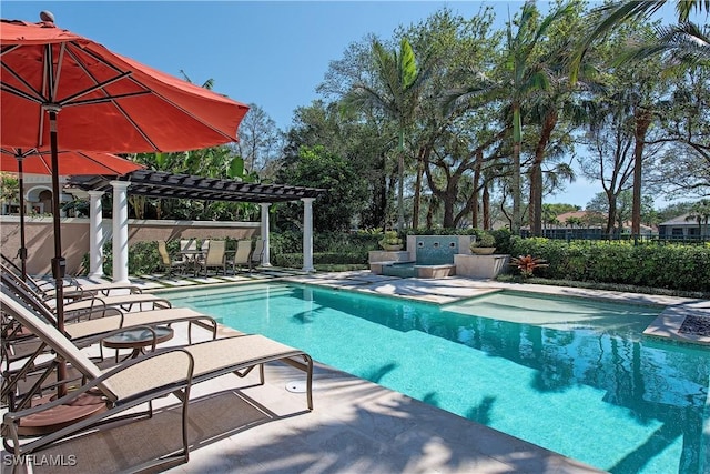 view of swimming pool featuring a patio and a pergola