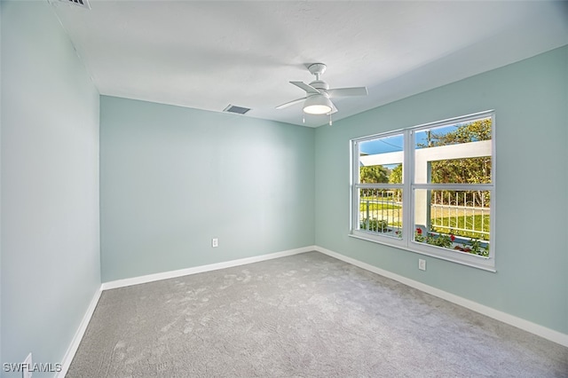 unfurnished room with carpet floors and ceiling fan