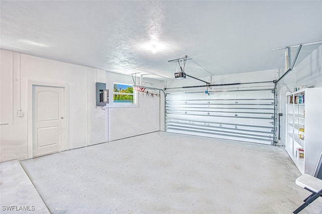 garage with electric panel and a garage door opener