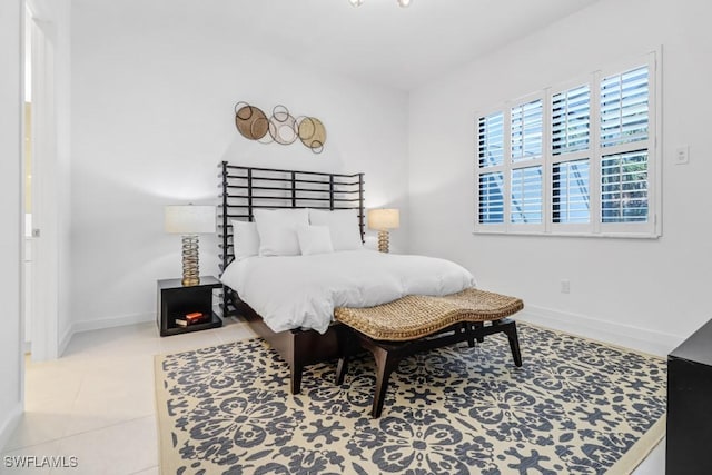 bedroom with light tile patterned floors