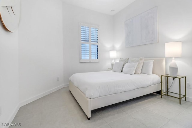 bedroom featuring light tile patterned flooring