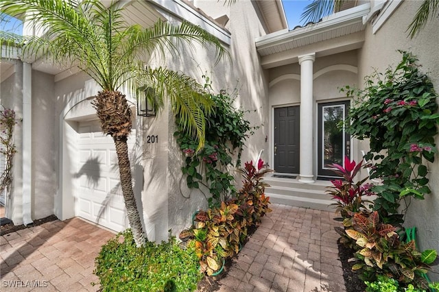 entrance to property featuring a garage