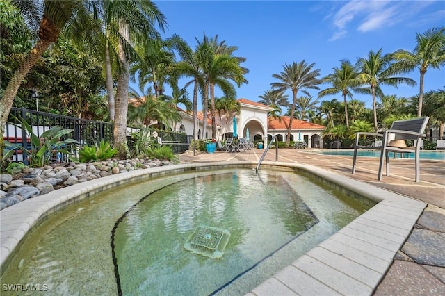 view of swimming pool with a patio