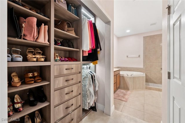 spacious closet with light tile patterned flooring