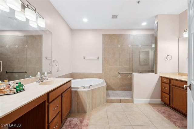 bathroom featuring independent shower and bath, tile patterned flooring, and vanity