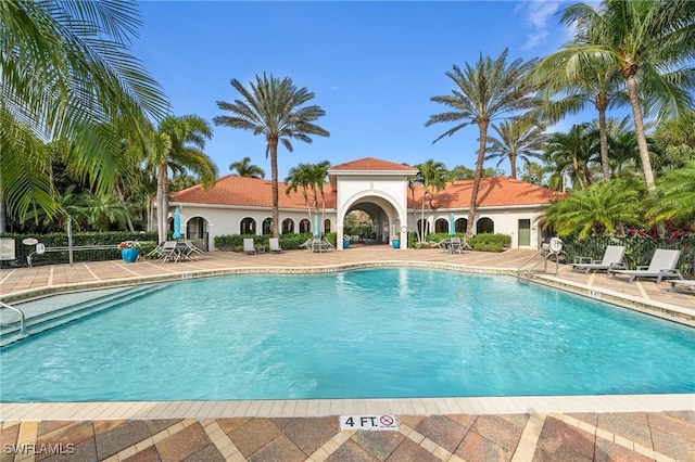 view of swimming pool featuring a patio area