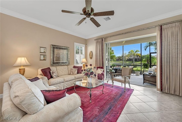 living room featuring ornamental molding, visible vents, ceiling fan, and light tile patterned floors