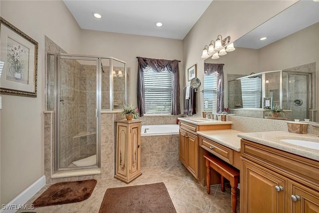 full bath with a stall shower, tile patterned floors, a garden tub, and vanity