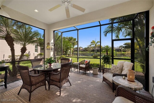 sunroom with a ceiling fan