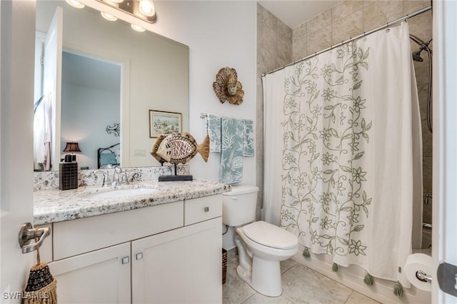 full bathroom featuring shower / bath combination with curtain, tile patterned flooring, vanity, and toilet