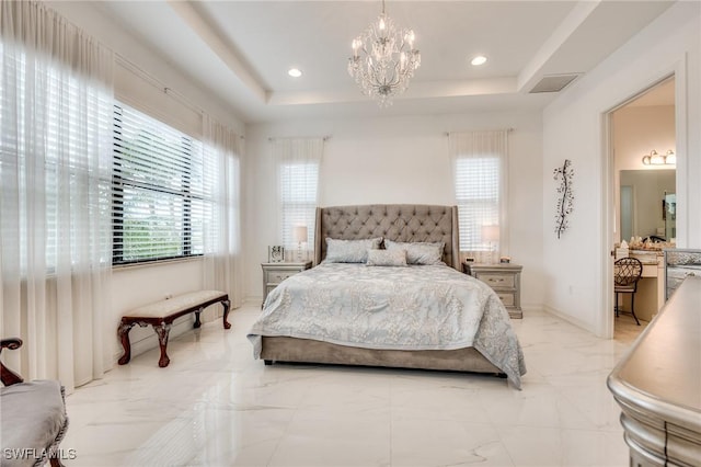 bedroom with a tray ceiling, marble finish floor, recessed lighting, visible vents, and an inviting chandelier