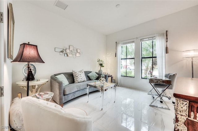 living room featuring visible vents