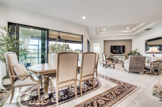 dining area featuring recessed lighting, a raised ceiling, visible vents, and light tile patterned floors