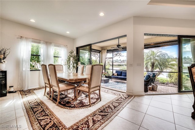 dining space with recessed lighting, ceiling fan, baseboards, and light tile patterned floors