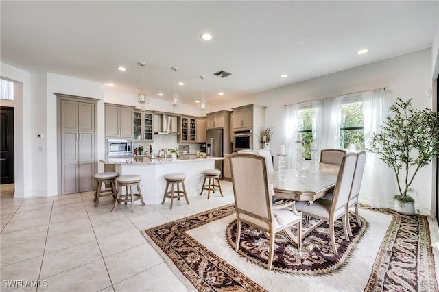 dining space featuring light tile patterned floors, visible vents, and recessed lighting