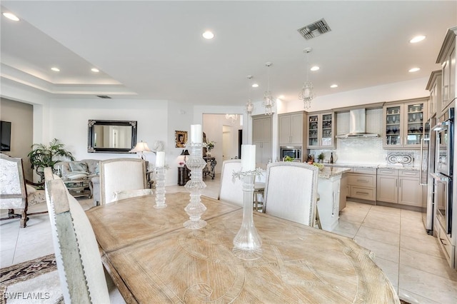 dining area with light tile patterned flooring, visible vents, and recessed lighting