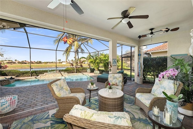 sunroom / solarium featuring a water view