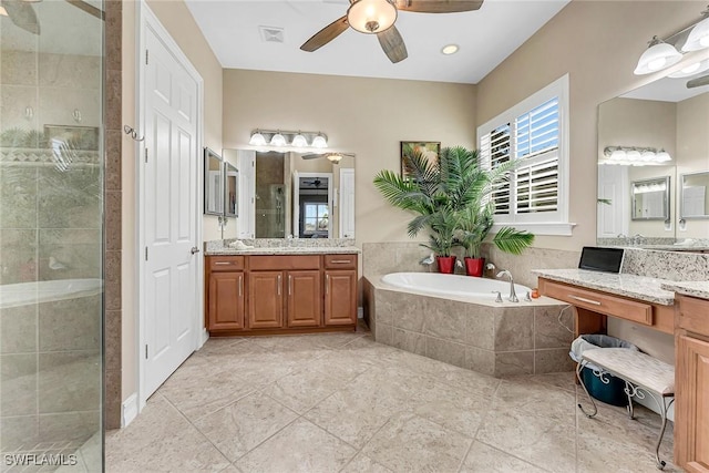 bathroom featuring ceiling fan, vanity, tile patterned flooring, and shower with separate bathtub