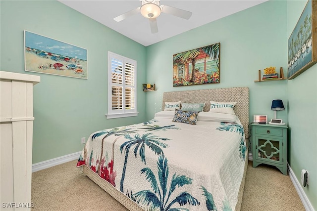 bedroom with ceiling fan and light carpet