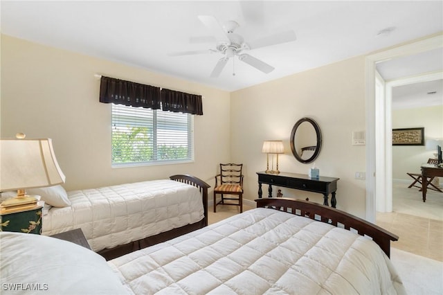 bedroom featuring a ceiling fan and baseboards