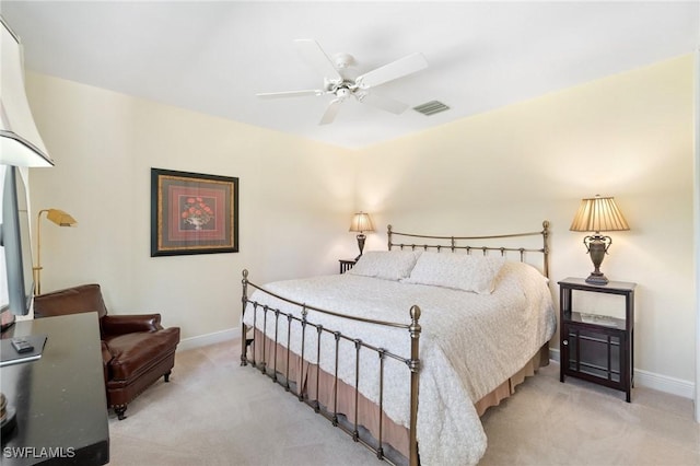 bedroom with baseboards, a ceiling fan, visible vents, and light colored carpet