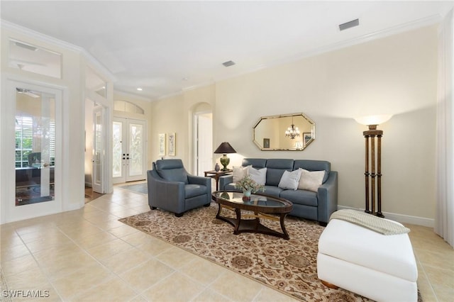 living room featuring french doors, light tile patterned flooring, visible vents, and crown molding