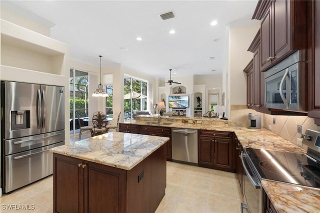 kitchen with visible vents, decorative backsplash, appliances with stainless steel finishes, light stone counters, and light tile patterned flooring