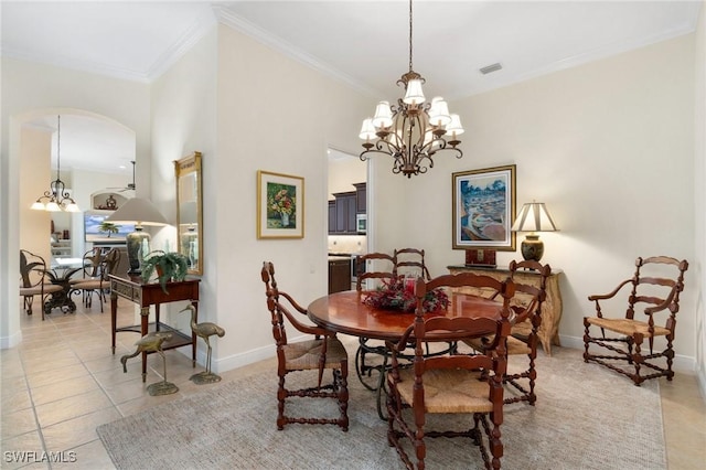 dining space with light tile patterned floors, visible vents, a chandelier, and ornamental molding