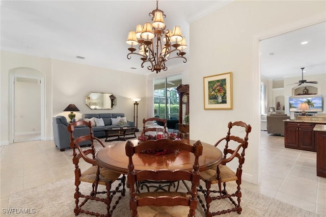 dining room with ceiling fan with notable chandelier, crown molding, baseboards, and light tile patterned floors