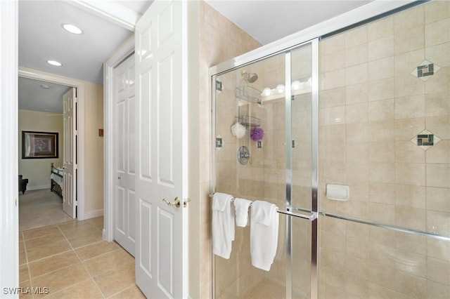 full bath with a stall shower, recessed lighting, baseboards, and tile patterned floors