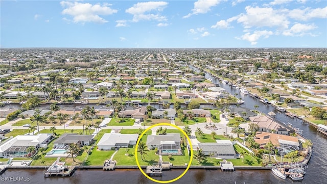 drone / aerial view featuring a residential view and a water view